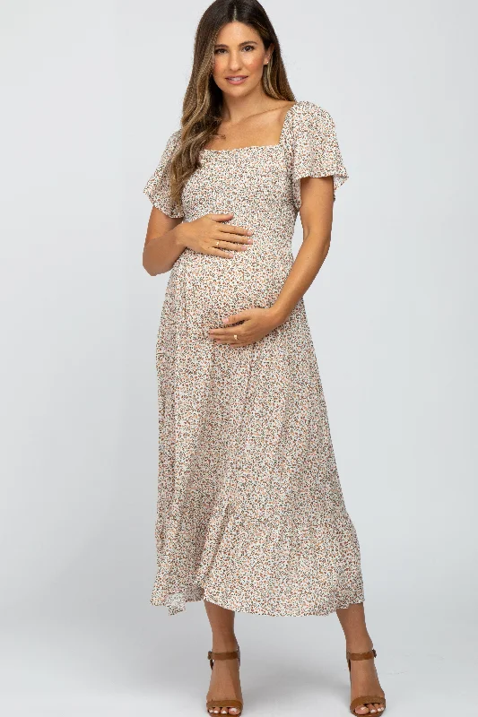 Printed Abstract Women Dress for a Modern and Artistic Appeal Printed Abstract Women Dress for a Modern and Artistic Appeal Ivory Floral Smocked Maternity Maxi Dress
