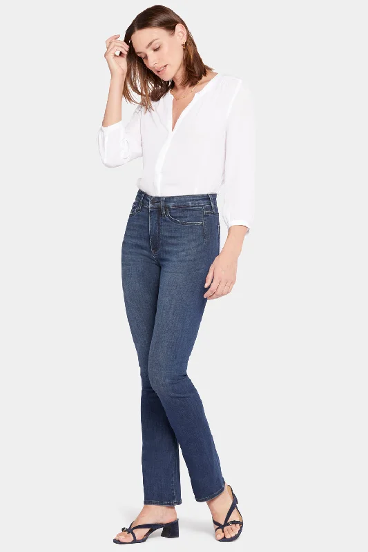 Distressed women jeans for a trendy and edgy lookLe Silhouette Slim Bootcut Jeans In Petite - Precious