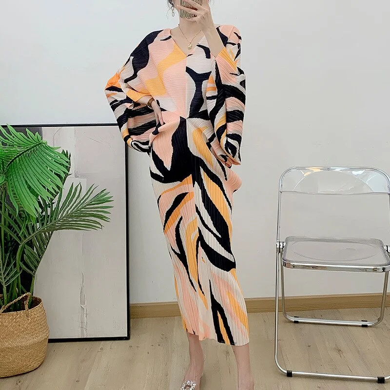 Sheer Bodysuits for a Seductive and Alluring OutfitMiyake Pleated Printed Batwing Sleeve Midi Dress